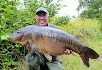 Chris Ball with a big mirror